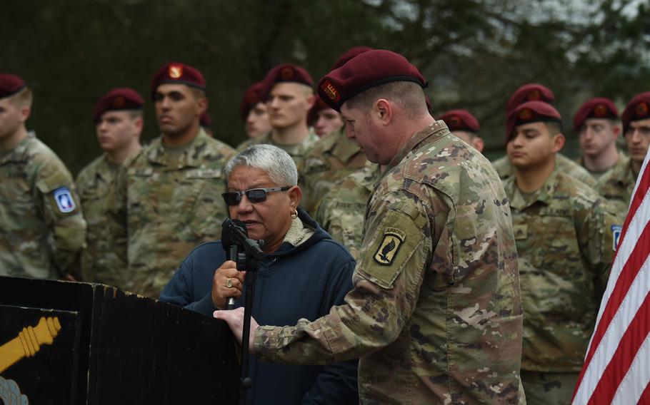 Cpl. Emmanuel Hernandez’s mother, Eli Cales, with the help of an interpreter, speaks on the lasting legacy and memory of her son during a drop zone dedication ceremony at Grafenwoehr, Germany on April 20, 2023.