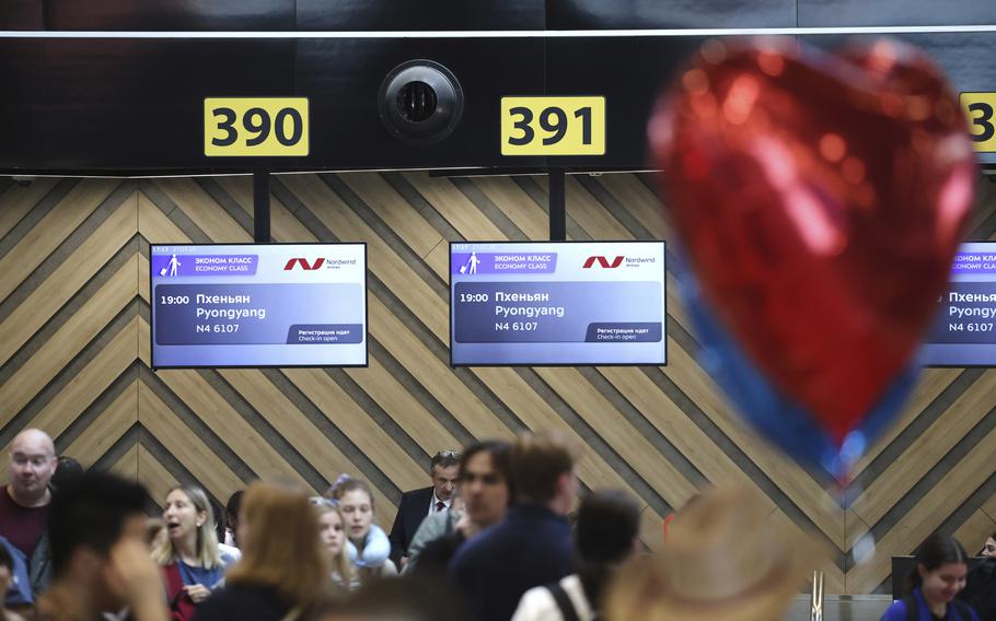 Information screens at the Moscow airport show flights to Pyongyang.