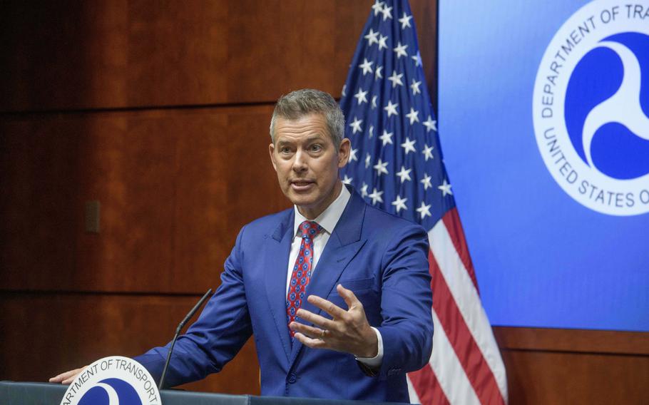 A man speaks at a podium.