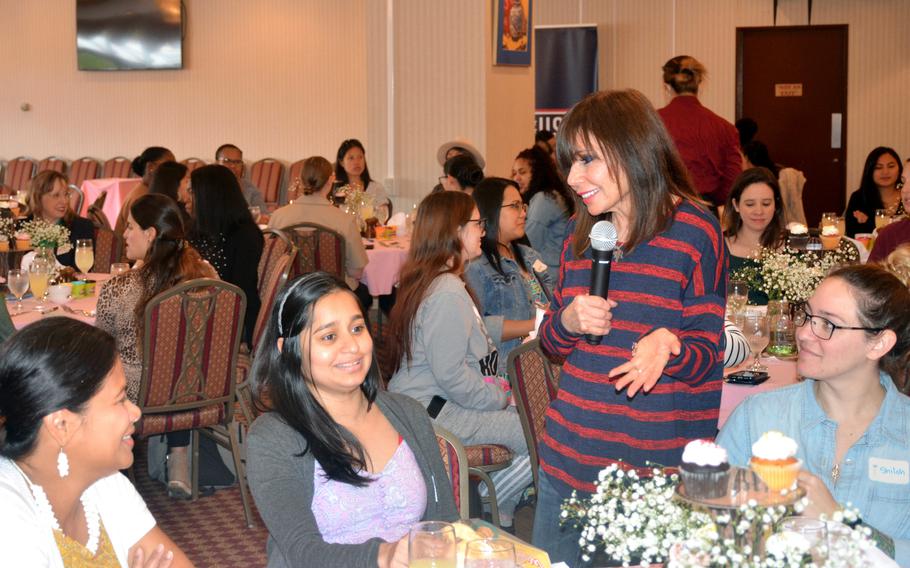 Heidi Murkoff, right, author of the best-selling "What to Expect" book series, speaks with guests at a Special Delivery baby shower at Yokosuka Naval Base, Japan, Oct. 24, 2022.