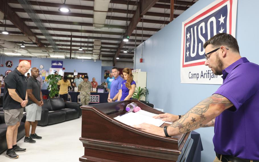 David Long, a duty manager for the USO at Camp Arifjan, Kuwait, speaks at a Purple Heart Day event at the base Aug. 7, 2022.