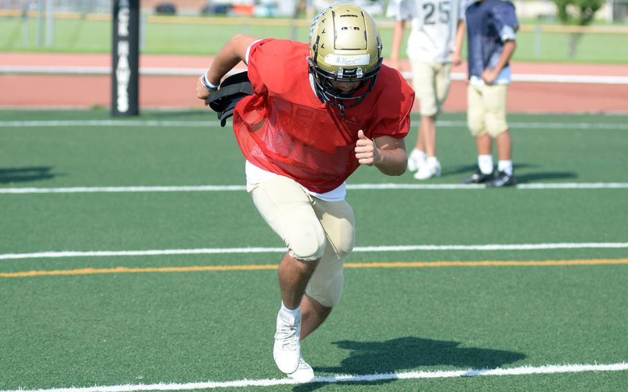 Bradley Miller runs in practice.