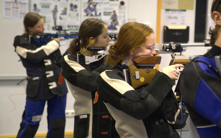 Shooters dial in their shots in the standing position during the morning's first relay of the DODEA-Europe marksmanship competition at Vilseck High School on Dec. 9, 2023.