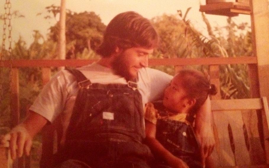 Randy Murch with his daughter, Devaki, in Hawaii not long after she was adopted in 1975.