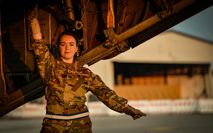 Air Force Capt. Samantha Stilwell, 86th Aeromedical Evacuation Squadron medical crew director, gives litter-bearers the go-ahead to board a C-130H Hercules during a medical evacuation exercise June 6, 2023, at Ramstein Air Base, Germany.