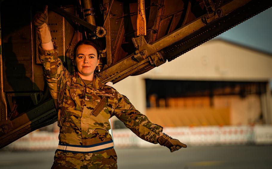 Air Force Capt. Samantha Stilwell, 86th Aeromedical Evacuation Squadron medical crew director, gives litter-bearers the go-ahead to board a C-130H Hercules during a medical evacuation exercise June 6, 2023, at Ramstein Air Base, Germany.