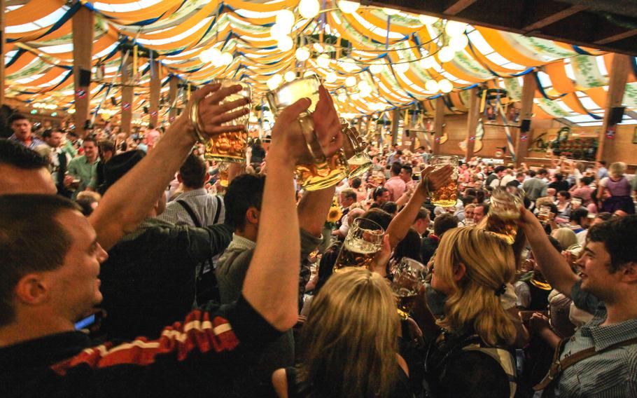 Revelers raise their glasses.
