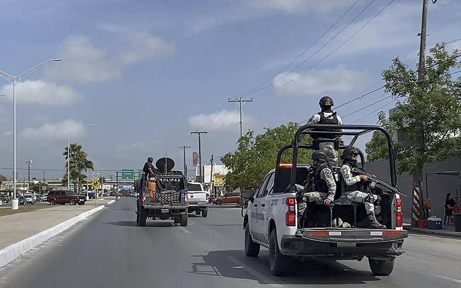 National Guard and military vehicles take part in an operation to transfer two of the four U.S. citizens kidnapped in Mexico back to Brownsville, Texas, after the other two were found dead, in Matamoros, Mexico, on March 7, 2023. 