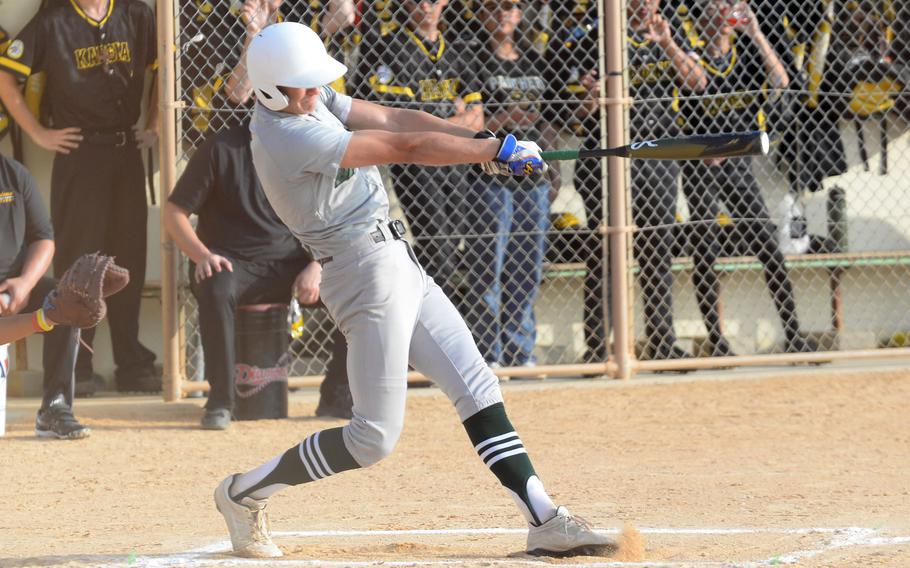 Kubasaki's Asher Romnek belts the first of his two home runs against Kadena during Monday's DODEA-Okinawa baseball game. The Dragons won 16-0.