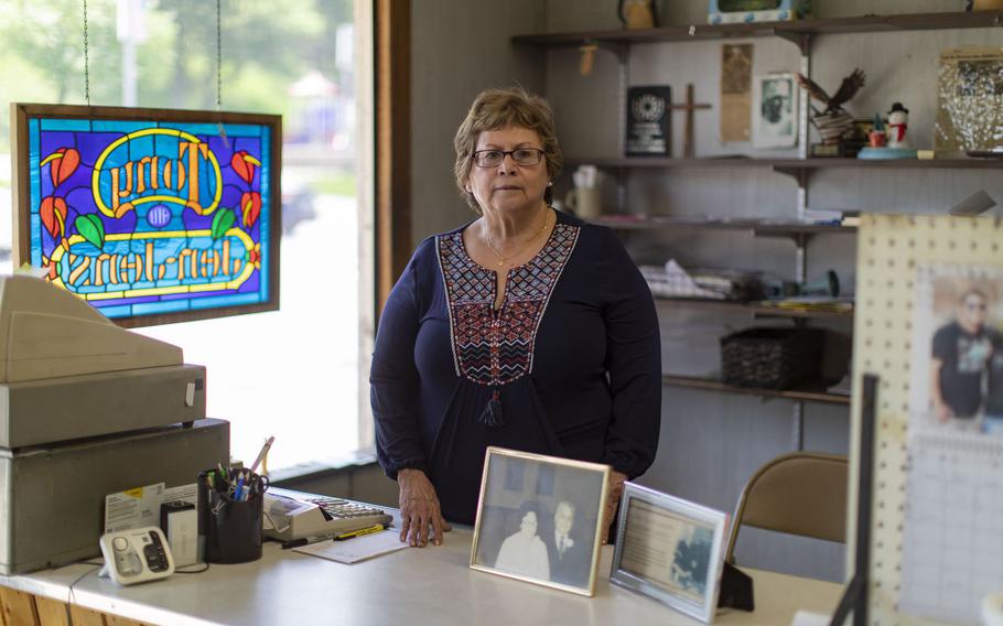Sylvia Soliz stands behind the counter at Tony’s Market on May 11, 2022, along Hero Street in Silvis, Ill. Soliz plans to close the 75-year-old market, named for her father, Tony Saucedo, and retire this fall.