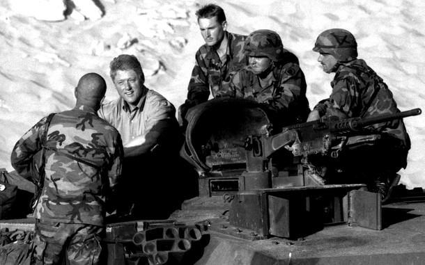 Kuwait, October 28, 1994:  President Bill Clinton chats with soldiers from the 69th Armored Regiment during a visit to Tactical Assembly Area Liberty in the Kuwaiti desert.
 
Looking for Stars and Stripes’ historic coverage? Subscribe to Stars and Stripes’ historic newspaper archive! We have digitized our 1948-1999 European and Pacific editions, as well as several of our WWII editions and made them available online through https://starsandstripes.newspaperarchive.com/

META TAGS: Kuwait; Iraq; U.S. Army; 