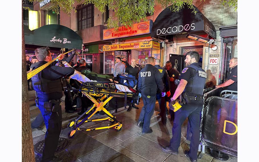 First responders arrive at the scene of a shooting at the Decades nightclub in Washington, D.C., on Friday, April 26, 2024.