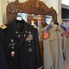 Le Roy Torres looks at the two uniforms that defined his adult life — his final dress uniform from 23 years in the Army and Army Reserve, from which he medically retired as a captain, and the final uniform that he wore during his 14 years as a Texas state trooper, at his home in Robstown, Texas, on Oct. 3, 2019. Torres sued the state of Texas in 2017 because he believed he was forced out of his job as a trooper due to injuries that he sustained on deployment. A jury on Sept. 29, 2023, agreed with him and awarded him nearly $2.5 million. 