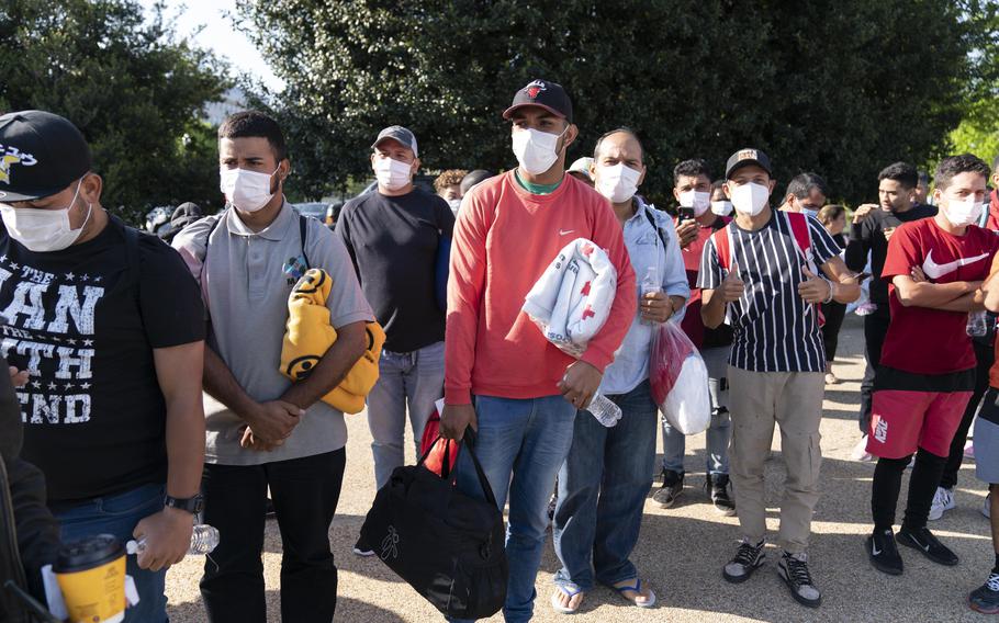 Migrants at Union Station near the U.S. Capitol in Washington hold Red Cross blankets after arriving April 27, 2022, on buses from Texas. D.C. Mayor Muriel Bowser said Thursday, July 28, 2022, that she has requested National Guard assistance to help stem a “growing humanitarian crisis” prompted by thousands of migrants that have been sent to Washington by Texas Gov. Greg Abbott. 