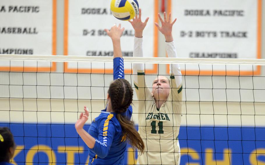 Yokota's Makayla Clouse and Robert D. Edgren's Kaitlyn Willets battle for the ball at the net during Saturday's DODEA-Japan volleyball match. The Panthers won in five sets, splitting their weekend series with the Eagles.