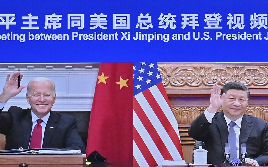 In this photo released by Xinhua News Agency Chinese President Xi Jinping, right and U.S. President Joe Biden appear on a screen as they hold a meeting via video link, in Beijing, China, Tuesday, Nov. 16, 2021. President Joe Biden opened his virtual meeting with China’s President Xi Jinping by saying the goal of the two world leaders should be to ensure that competition between the two superpowers “does not veer into conflict.”