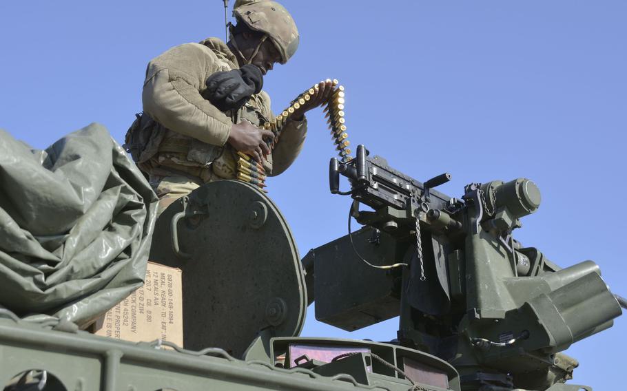 Army Spc. Daniel Howard, a cavalry scout with 8th Squadron, 1st Cavalry Regiment, 2nd Stryker Brigade Combat Team, removes unused rounds from an M-2 Browning machine gun at Rodriguez Live Fire Complex in Pocheon, South Korea, Tuesday, Jan. 10, 2023.