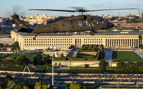 Four UH-60 Blackhawks assigned to the U.S. Army's 12th Aviation Battalion perform a flyover during the national anthem at the 2023 Army Ten-Miler, Arlington, Virginia, October 8, 2023. The Army’s annual Army Ten-Miler Race and Expo is conducted in Washington, D.C., by the U.S. Army Military District of Washington (MDW). The 12th Aviation Battalion conducts air movement and engineer technical rescue operations for senior leaders of the Army, Department of Defense, and United States Government, while maintaining a continuous alert posture in support of the Joint Task Force-National Capital Region in order to sustain a rapid response, readiness, and support force capability.