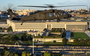 Four UH-60 Blackhawks assigned to the U.S. Army's 12th Aviation Battalion perform a flyover during the national anthem at the 2023 Army Ten-Miler, Arlington, Virginia, October 8, 2023. The Army’s annual Army Ten-Miler Race and Expo is conducted in Washington, D.C., by the U.S. Army Military District of Washington (MDW). The 12th Aviation Battalion conducts air movement and engineer technical rescue operations for senior leaders of the Army, Department of Defense, and United States Government, while maintaining a continuous alert posture in support of the Joint Task Force-National Capital Region in order to sustain a rapid response, readiness, and support force capability.