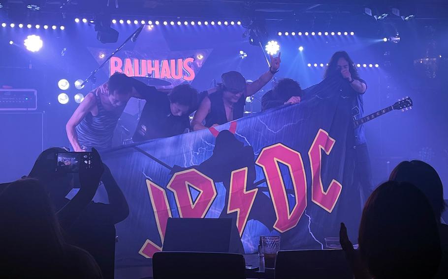 JP/DC, an AC/DC tribute band, takes a bow after a performance at Bauhaus in Tokyo’s Roppongi district, July 24, 2022.