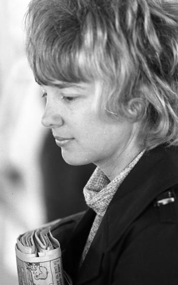 A woman looks to the side