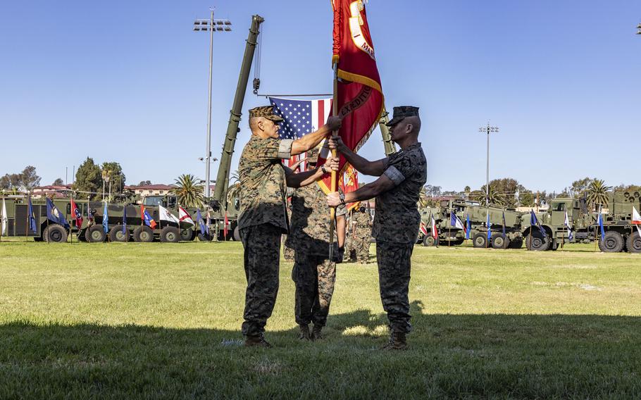 Lt. Gen. Karsten S. Heckl, former commanding general, I Marine Expeditionary Force (MEF), passes the colors to Lt. Gen. George W. Smith Jr., signifying the change of command of I MEF during a formal ceremony Sept. 23, 2021, at the 11 Area Parade Deck on Marine Corps Base Camp Pendleton, Calif.