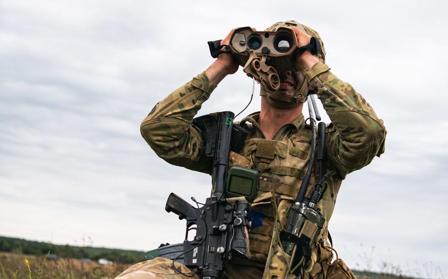 A U.S. Army paratrooper with the 173rd Airborne Brigade surveys the land during training near Yavoriv, Ukraine on Sept. 25, 2021.