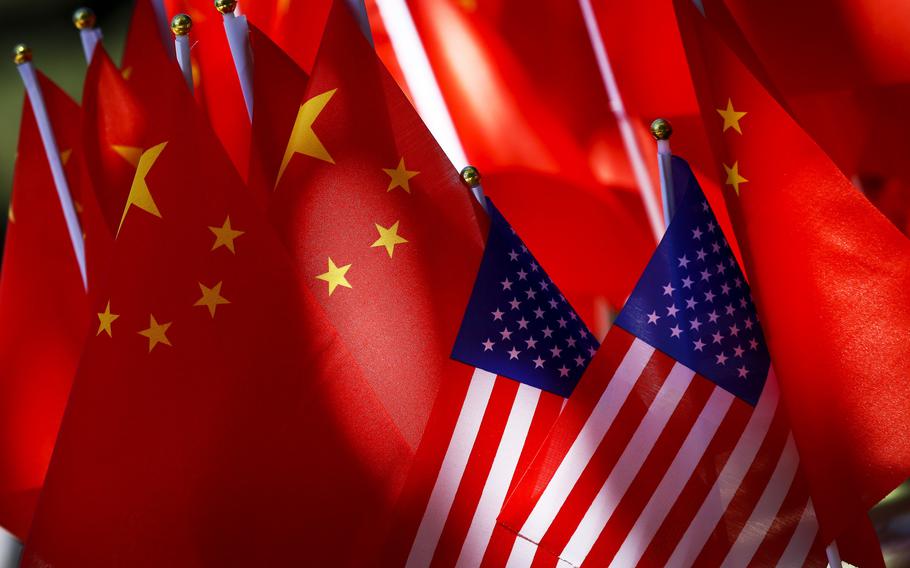 American flags are displayed together with Chinese flags in Beijing on Sept. 16, 2018. China’s Ministry of Commerce said Thursday, June 10, 2021, that the Biden administration’s move to revoke Trump administration executive orders intended to ban apps like TikTok and WeChat was a “positive step.”