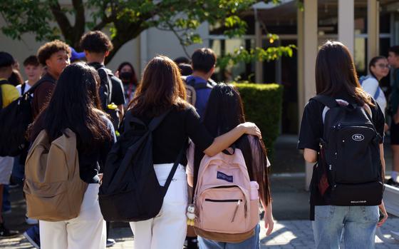 Students head to Zama Middle High School on the first day of classes at Camp Zama, Japan, Aug. 21, 2023. 