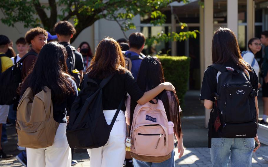 Students head to Zama Middle High School on the first day of classes at Camp Zama, Japan, Aug. 21, 2023. Changes to the special education program will be completed by next school year, DODEA officials said.