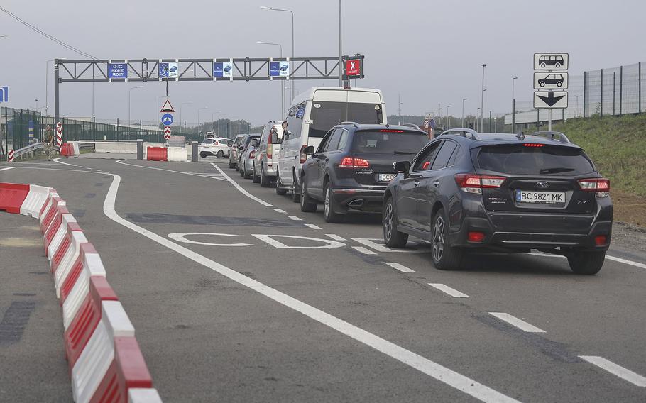 Cars queue towards Poland at the Krakovets - Korcheva border crossing point in Krakovets, Ukraine, Tuesday, Aug. 16, 2022.