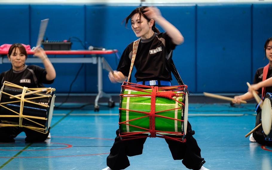 Taiko drummers perform at a school.