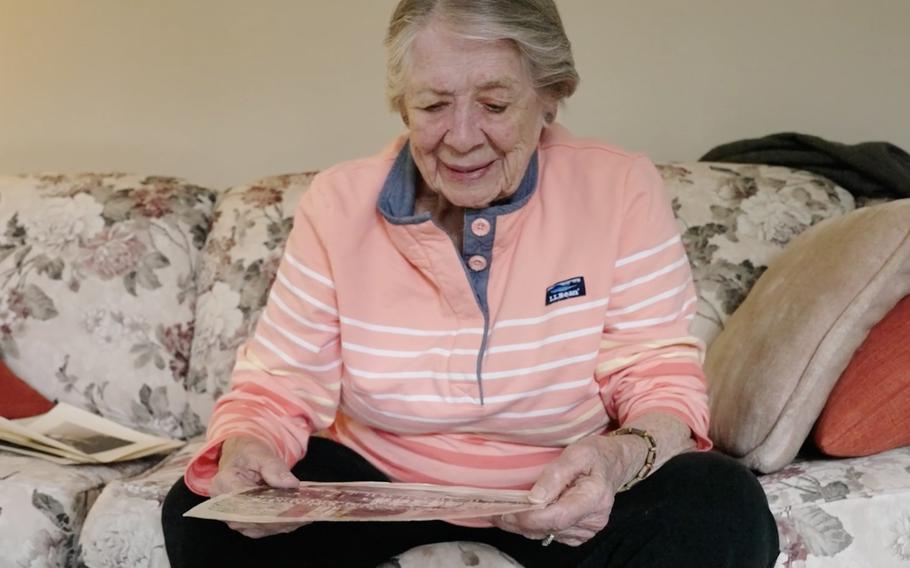 Julia Parsons looks at a photo of her WAVES unit, which helped break German Enigma codes during World War II for the Washington office known as OP-20-G. 