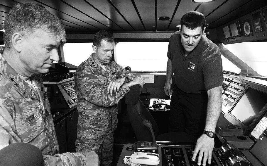 Gen. William Fraser III, center, commander of Transcom, is shown bridge controls of the high-speed vessel HSV-2 Swift in May 2012 during a visit to Rota, Spain.