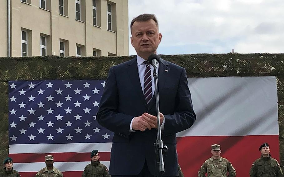 Poland Defense Minister Mariusz Blaszczak speaks in Poznan on March 21, 2023, during the activation of U.S. Army Garrison Poland. The event marked the establishment of the U.S. military’s first permanent base in the country.