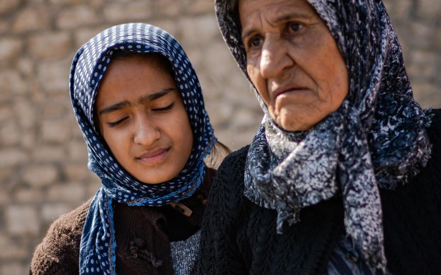 Mezyan, 12, and her grandmother Salwa in Jinderis, Syria, on Tuesday. The girl's immediate family died in an apartment collapse, and she had not been back to see her home since rescue workers pulled her from the ruins. She did not want to recover any possessions. "I just want my mother," she said.