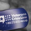 A photo illustration with the telephone number of the Veteran's Crisis Line. (U.S. Air Force photo illustration by Zachary Hada)