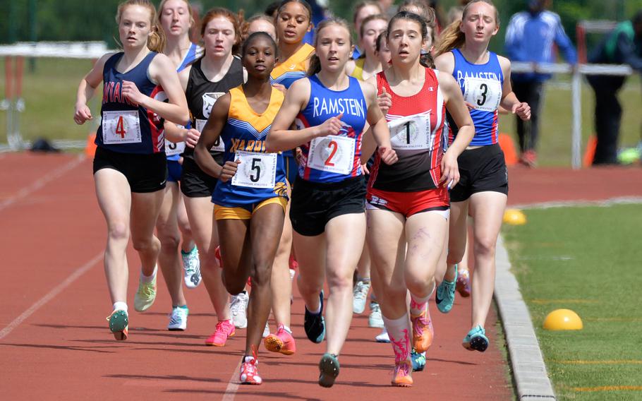 Ramstein’s Claire Dalling, center, leads the pack at the end of the first lap of the girls 800-meter race at the DODEA-Europe track and field championships in Kaiserslautern, Germany, May 19, 2023. Dalling broke away on the last lap to win comfortably in 2 minutes, 24.85 seconds.