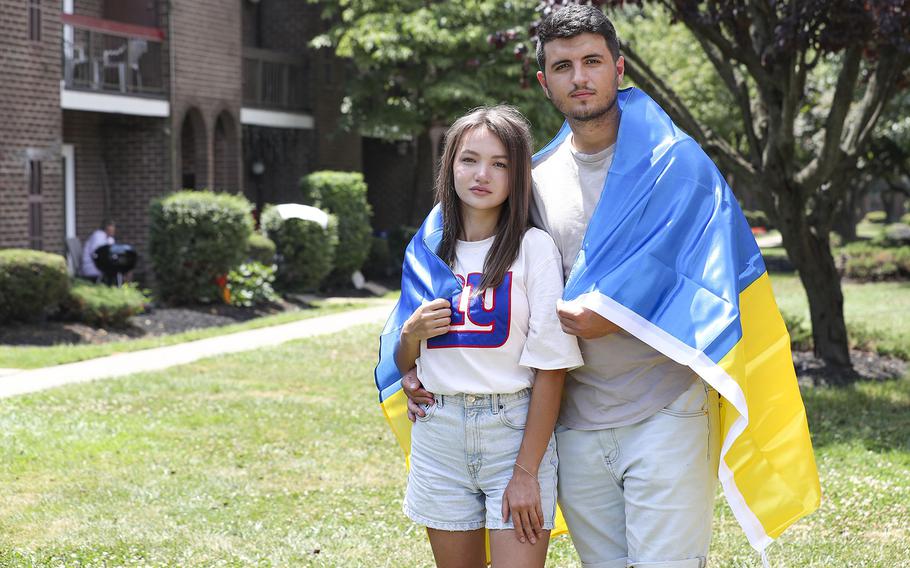 Valentyn Khimchuk and his girlfriend, Roksolana Tokarevych, left, both 21, outside the home of an uncle in Northeast Philadelphia. Khimchuk and Tokarevych arrived in the U.S. from Ukraine on July 8, 2022. Six days later they applied for work permits.