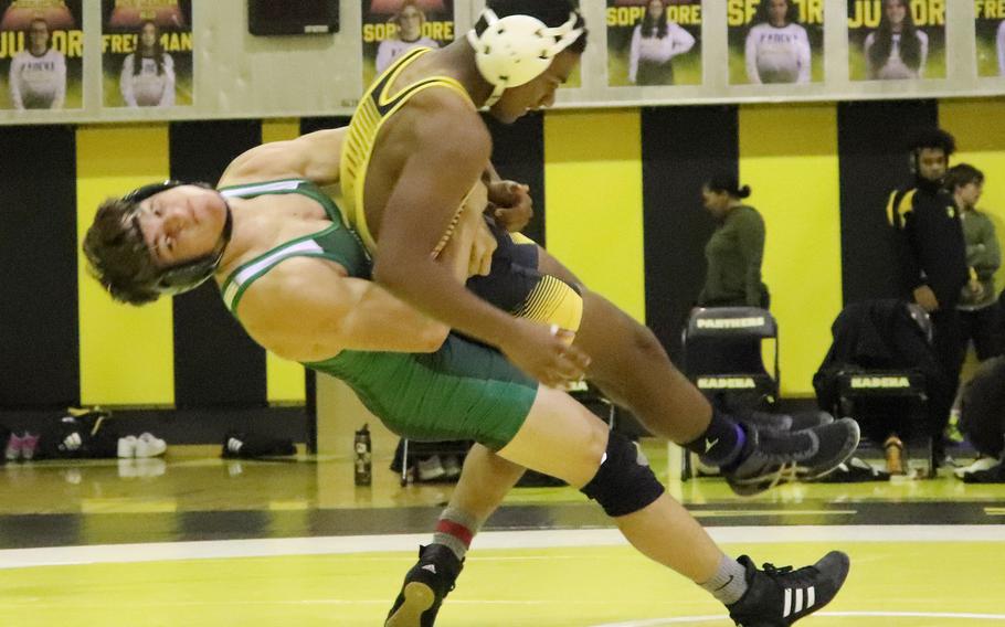 Kubasaki's Hayden Potter tosses Kadena's James Kinney at 158 pounds during Wednesday's Okinawa wrestling dual meet. Potter pinned Kinney in 5 minutes, 37 seconds and the Dragons took the meet 40-23.