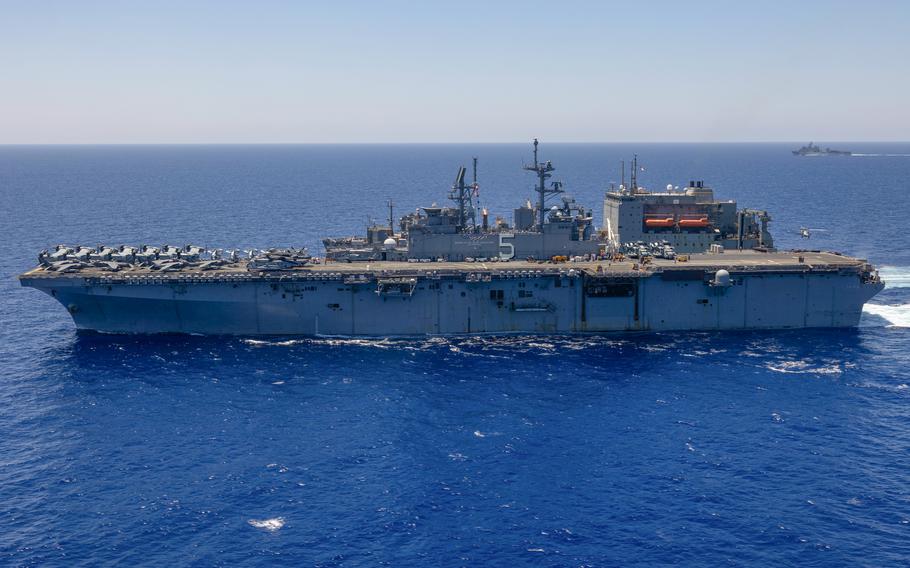 USS Bataan and USNS Medgar Evers conduct a replenishment in the Mediterranean Sea on Aug. 4, 2023. Along with the dock landing ship USS Carter Hall, Bataan is in the eastern Mediterranean to reintegrate the Bataan Amphibious Ready Group, the Navy said Thursday. 