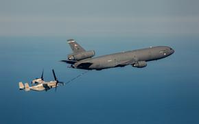 PACIFIC OCEAN (Jan. 25, 2023) A KC-10 Extender, assigned to the 6th Air Refueling Squadron, and a CMV-22B Osprey, assigned to Fleet Logistics Multi-Mission Squadron (VRM) 30, perform a mid-flight refueling. VRM 30, assigned to Carrier Air Wing 9, is currently based out of Naval Air Station North Island in support of routine operations in U.S. 3rd Fleet. (U.S. Navy photo by Mass Communication Specialist 2nd Class Lake Fultz)