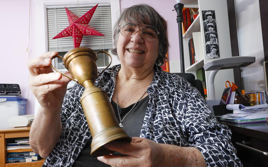 Tandova “Tandy” Ecenia, 69,  of Tampa holds her farther’s dance trophy Tuesday, Nov. 23, 2021 in Tampa. Tandy was recently contacted by a stranger who said they had a trophy that belonged to her father Martin Ecenia. The trophy was for winning a dancing contest held in October of 1941 in Pearl Harbor.