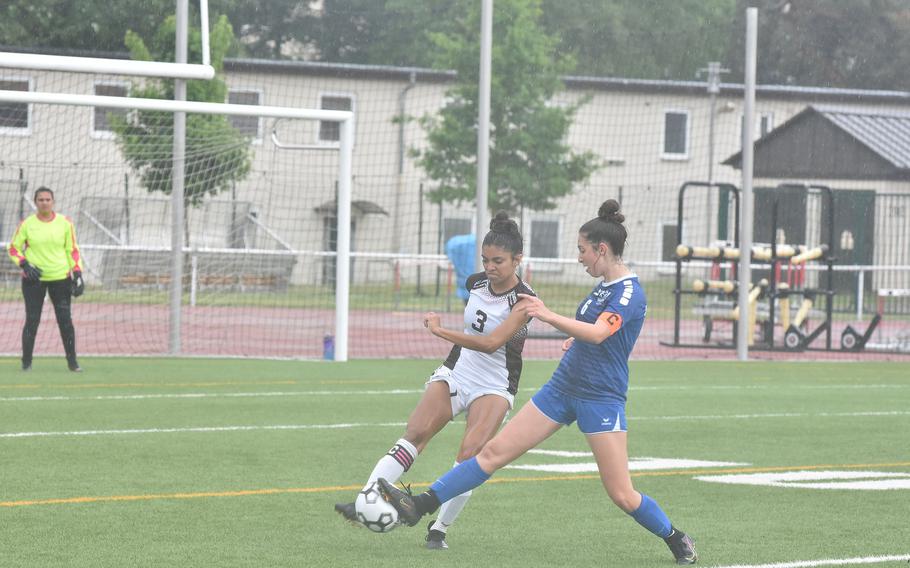 Ramstein's Eleftheria Randitsas ties up Vilseck's Megan VanGilder during a steady rain Monday, May 16, 2022, at the DODEA-Europe girls Division I soccer championshps at Vogelweh, Germany.