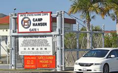 A car leaves Camp Hansen, a Marine Corps base on Okinawa, Monday, Dec. 20, 2021. 