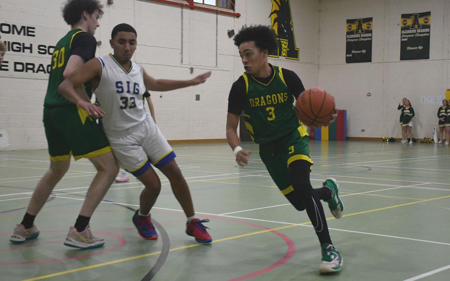 Alconbury's Julian Brazoban drives to the basket against the Sigonella Jaguars on Saturday. The Dragons hosted Sigonella and Hohenfels for Friday and Saturday games on the second weekend of the DODEA-Europe basketball season.