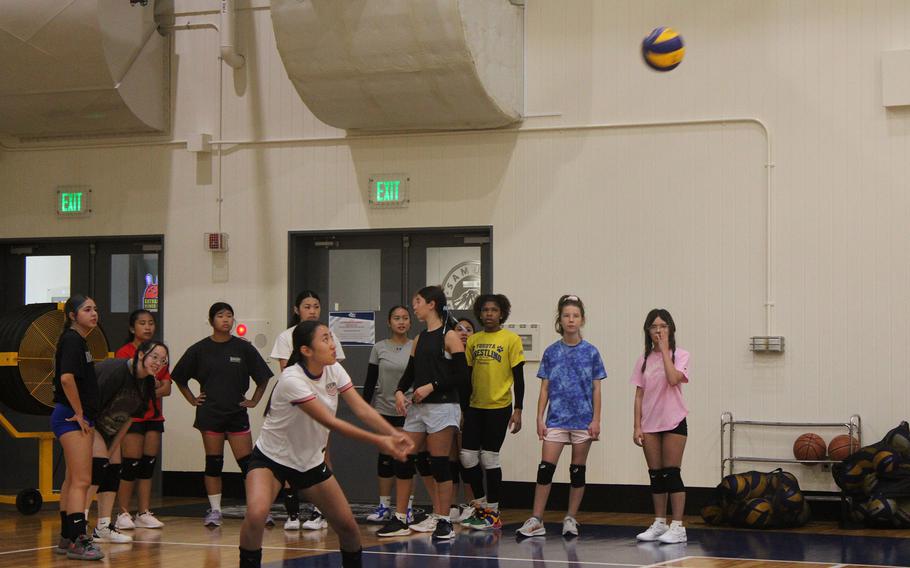 Yokota volleyball players practice.