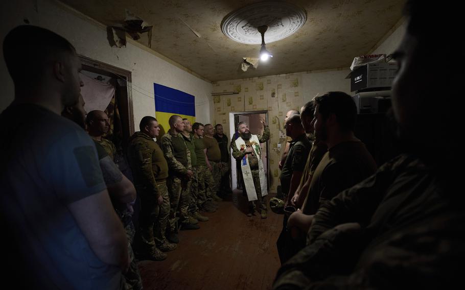Ukrainian servicemen attend an Easter service
