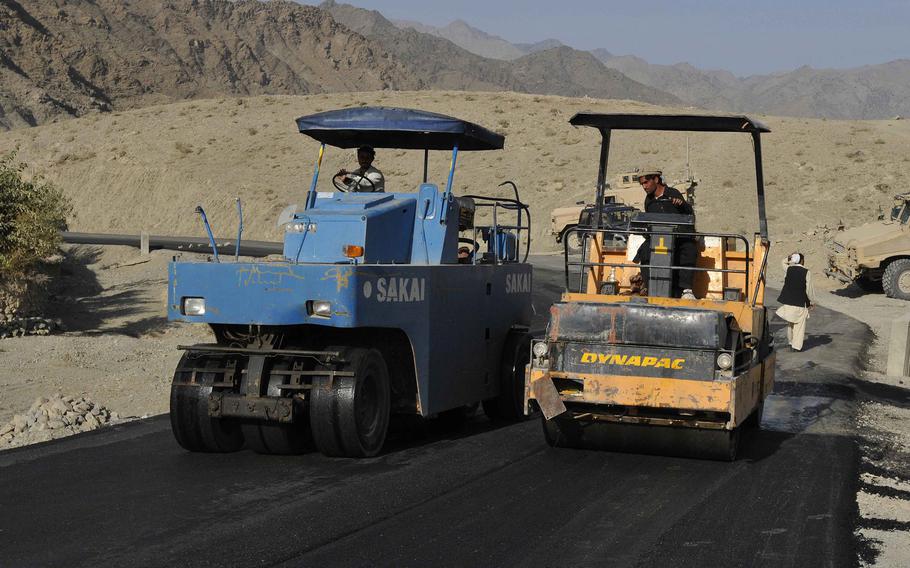 Contractors build new sections of road in Spera, Afghanistan, in 2007. A watchdog agency’s 2021 report revealed a lack of oversight and accountability in the awarding of contracts in Afghanistan.