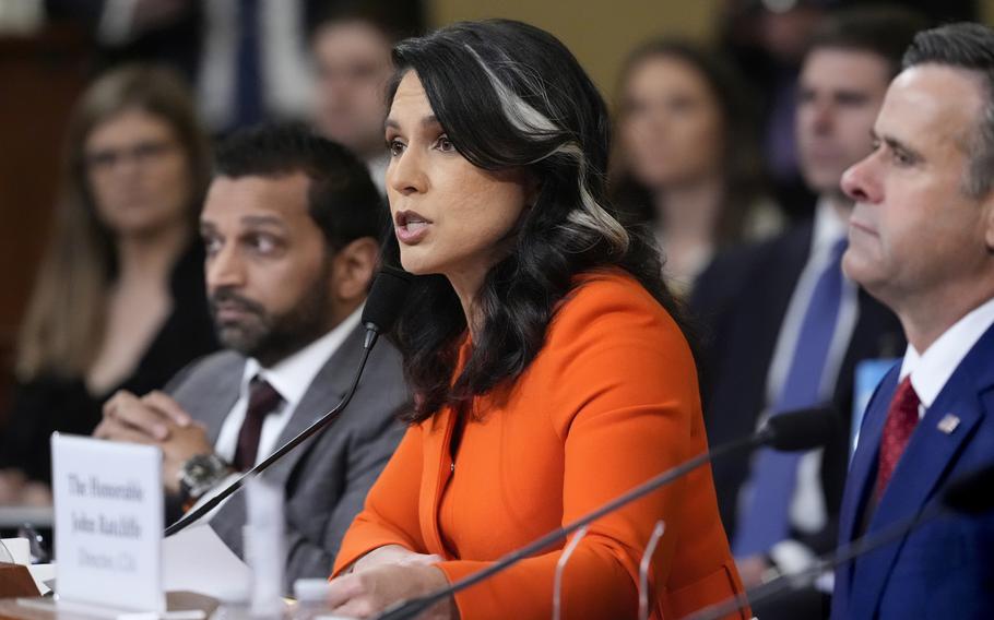 Patel, Gabbard and Ratcliffe at a table.